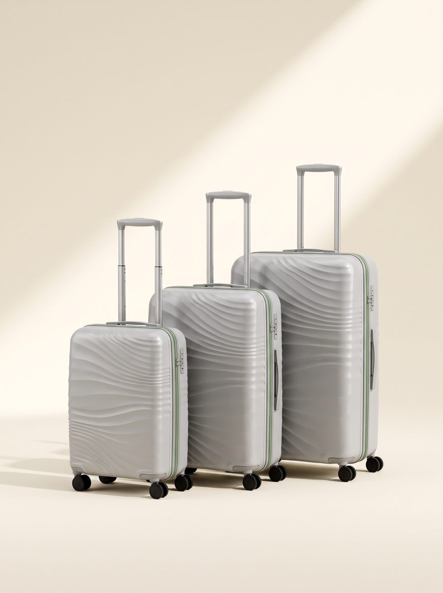 ECO collection hardshell luggage set in silver with a wave texture.
